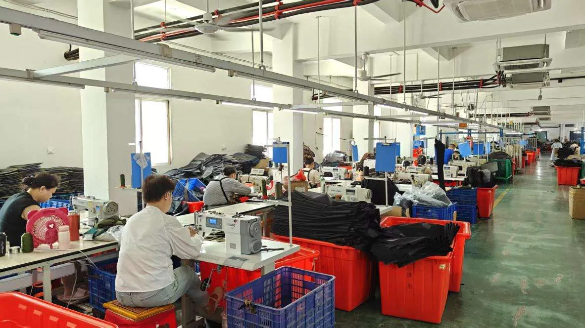 Vegasecurity factory production line with skilled workers operating sewing machines for tactical gear manufacturing